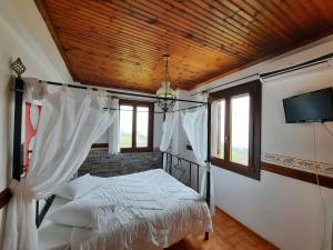 Postel nebo postele na pokoji v ubytování Αρχοντικό Κονάκι- Konaki Pelion