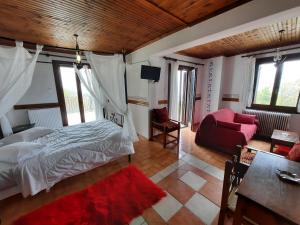 Postel nebo postele na pokoji v ubytování Αρχοντικό Κονάκι- Konaki Pelion