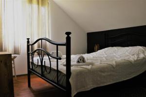 Кровать или кровати в номере Casa Podragu