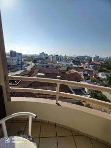 a balcony with a view of a city at Apartamento completo em Joinville no Costa e Silva - Há 50 km das Praias SC in Joinville