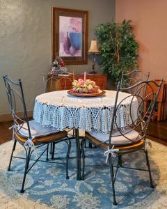a dining room table with a plate of flowers on it at Guest Apartment at Commercial Street Studio in Lebanon