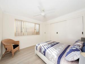 A bed or beds in a room at Bombora @ Fingal Bay