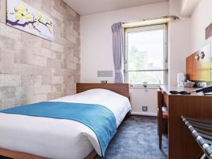 Postel nebo postele na pokoji v ubytování Central Hotel Okayama + 37 fotografií