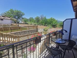 a patio with chairs and a table on a balcony at Astra in Agerola