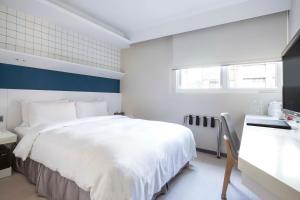 Postel nebo postele na pokoji v ubytování Dandy Hotel - Tianmu Branch