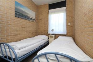 Ein Bett oder Betten in einem Zimmer der Unterkunft contract stopgezet 30-3-2024