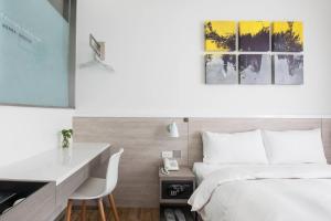 Letto o letti in una camera di CityInn Hotel Plus- Fuxing North Road Branch