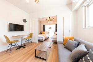 TV a/nebo společenská místnost v ubytování SG RESIDENCE INN HAKATA