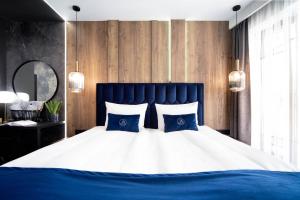 Voodi või voodid majutusasutuse Jacuzzi Apartment Main Square toas