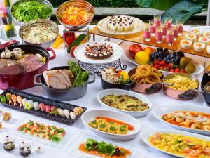 a table topped with lots of different types of food at Miyakojima Tokyu Hotel & Resorts in Miyako-jima