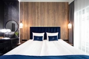 Voodi või voodid majutusasutuse Jacuzzi Apartment Main Square toas