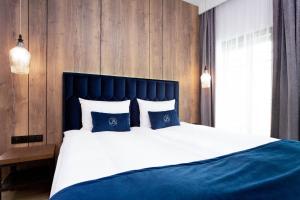 Voodi või voodid majutusasutuse Jacuzzi Apartment Main Square toas