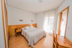 Postel nebo postele na pokoji v ubytování Alvi