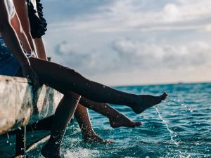 a person sitting on a boat in the water at Miyakojima Tokyu Hotel & Resorts in Miyako-jima