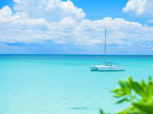 a boat sitting on the water in the ocean at Miyakojima Tokyu Hotel & Resorts in Miyako-jima