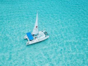 a small boat floating in the water at Miyakojima Tokyu Hotel & Resorts in Miyako-jima