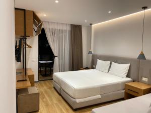Postel nebo postele na pokoji v ubytování NOI HOTEL