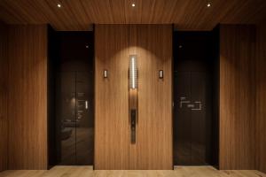 a elevator in a building with wooden walls at Bespoke Hotel Sapporo in Sapporo