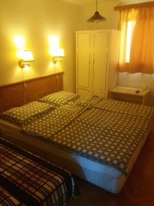 Posteľ alebo postele v izbe v ubytovaní Badacsonyi Lugas apartmanok