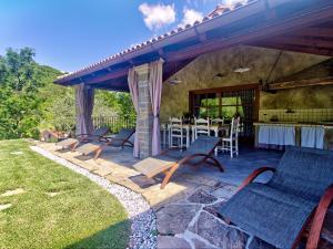 a group of chairs and a table on a patio at Apartma Rihter in Črni Kal