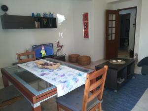 a dining room with a table with a bowl on it at Casa da Praia, Santa Luzia in Tavira