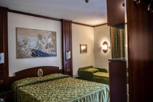 Posteľ alebo postele v izbe v ubytovaní Hotel Garibaldi