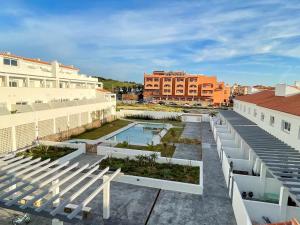 arial view of a building with bleachers and a pool at Tarifa Beach Rentals Sunset in Tarifa