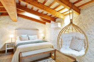 Postel nebo postele na pokoji v ubytování El Pajar del Emporda - Costa Brava