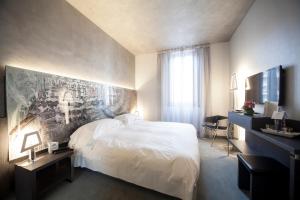 Postel nebo postele na pokoji v ubytování Arli Hotel Business and Wellness