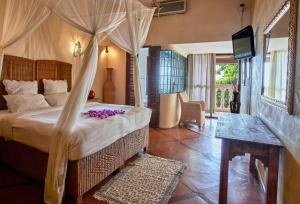 Voodi või voodid majutusasutuse Catembe Gallery Hotel toas