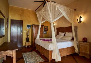 Voodi või voodid majutusasutuse Catembe Gallery Hotel toas