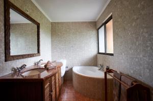 Vannituba majutusasutuses Catembe Gallery Hotel