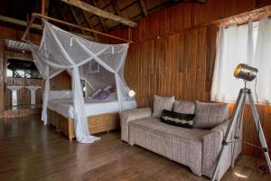 Voodi või voodid majutusasutuse Catembe Gallery Hotel toas