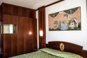 Posteľ alebo postele v izbe v ubytovaní Hotel Garibaldi
