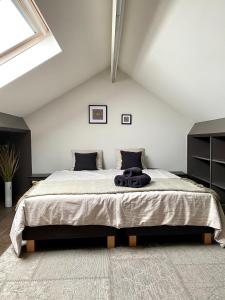 מיטה או מיטות בחדר ב-LE REFUGE D'ELI - La Maison