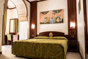 Posteľ alebo postele v izbe v ubytovaní Hotel Garibaldi