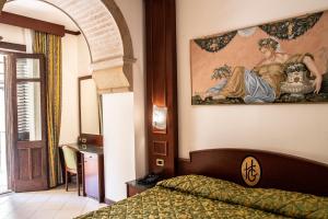 Posteľ alebo postele v izbe v ubytovaní Hotel Garibaldi