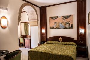 Posteľ alebo postele v izbe v ubytovaní Hotel Garibaldi