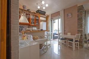 a kitchen with a table and a dining room at Rogiual in Rome