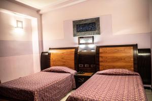 Posteľ alebo postele v izbe v ubytovaní Hotel Garibaldi
