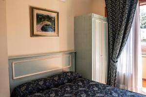 Posteľ alebo postele v izbe v ubytovaní Hotel Garibaldi