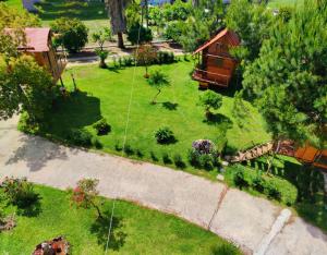 an aerial view of a yard with a house at Dream catcher treehouse in Preveza