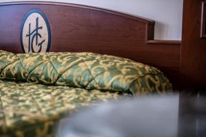 Posteľ alebo postele v izbe v ubytovaní Hotel Garibaldi