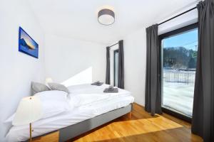 Łóżko lub łóżka w pokoju w obiekcie Podstata Apartments Vrchlabí - Rotterovka
