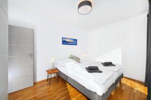 Łóżko lub łóżka w pokoju w obiekcie Podstata Apartments Vrchlabí - Rotterovka