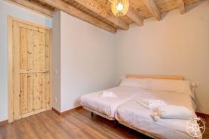 Posteľ alebo postele v izbe v ubytovaní CASA ERA CUMA de Alma de Nieve