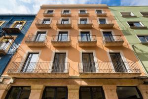 a building with balconies on the side of it at Tgna Cervantes 8 in Tarragona