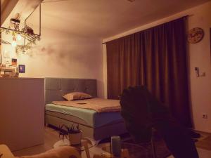 a bedroom with a bed and a glass table at Park Apartment in Foča