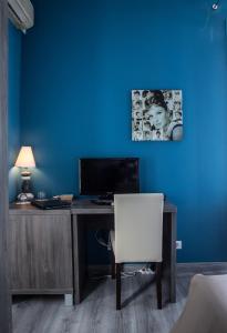 TV a/nebo společenská místnost v ubytování Hotel de charme Regency