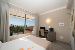 Postel nebo postele na pokoji v ubytování Hotel de charme Regency + 25 fotografií